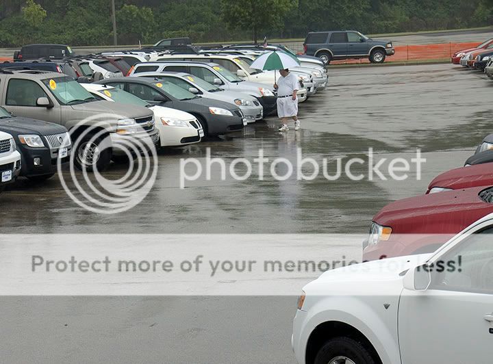 Big Car Sale at Miller Park - salesman walking the lot - copyright 2009 Jeffery Blackwell